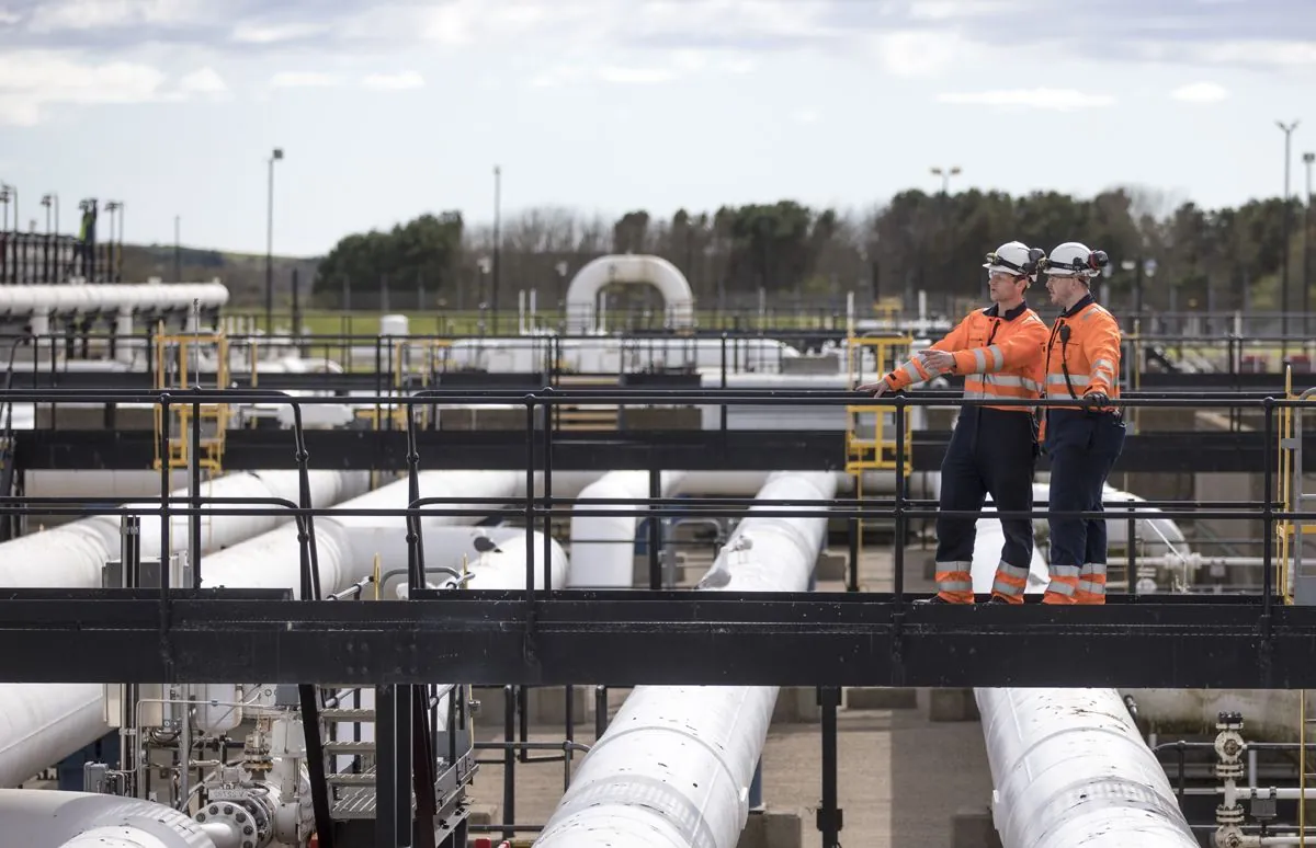 Engineers on a walkway at a National Gas site
